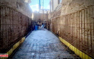 اجرای عملیات بتن‌ریزی کانال هدایت آب‌های سطحی در شهرک خاوران